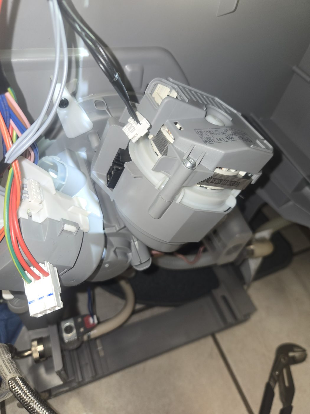 An appliance electronic control board and wiring harness during diagnosis