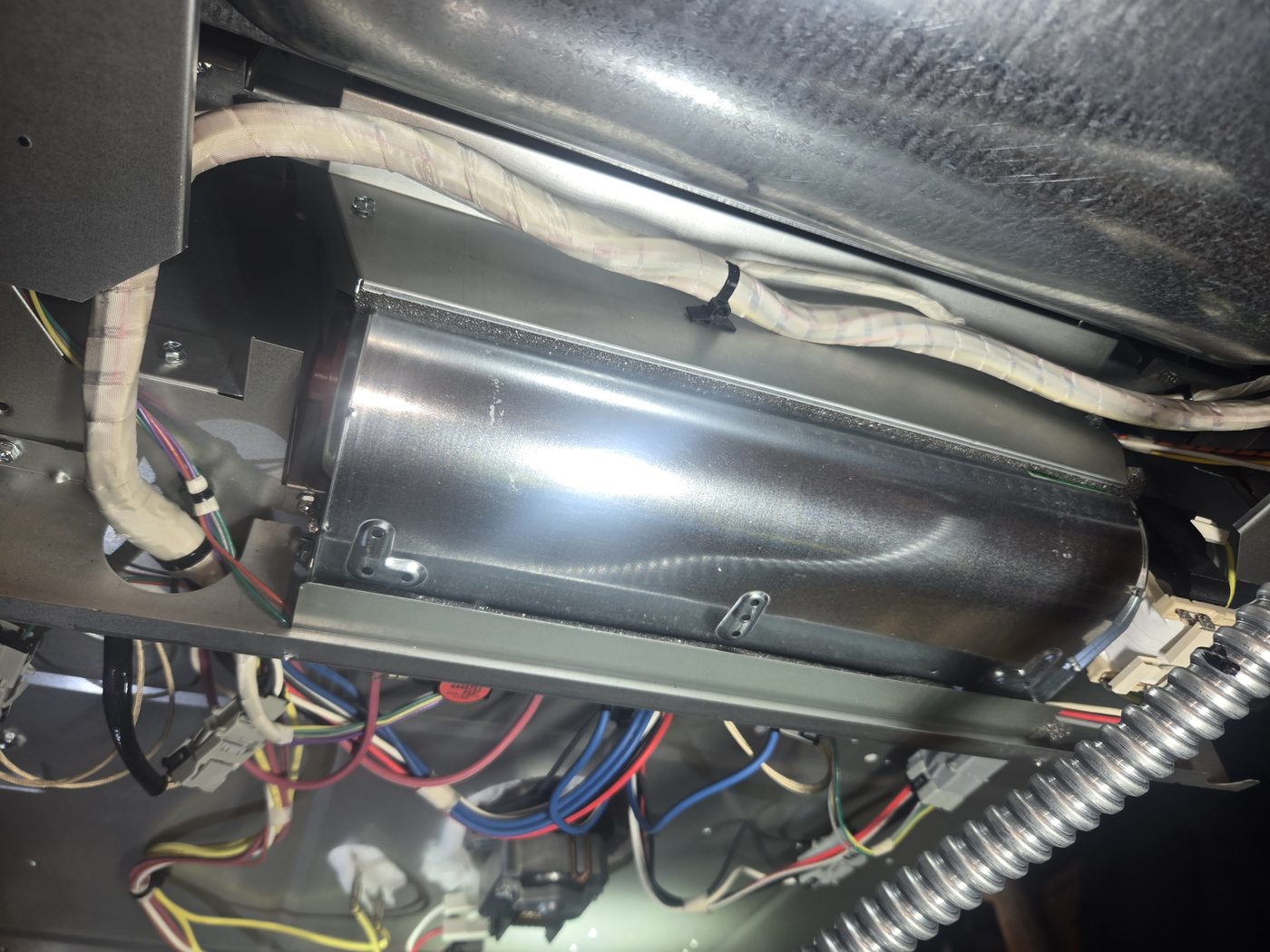 Blower housing and internal components inside a dryer during service