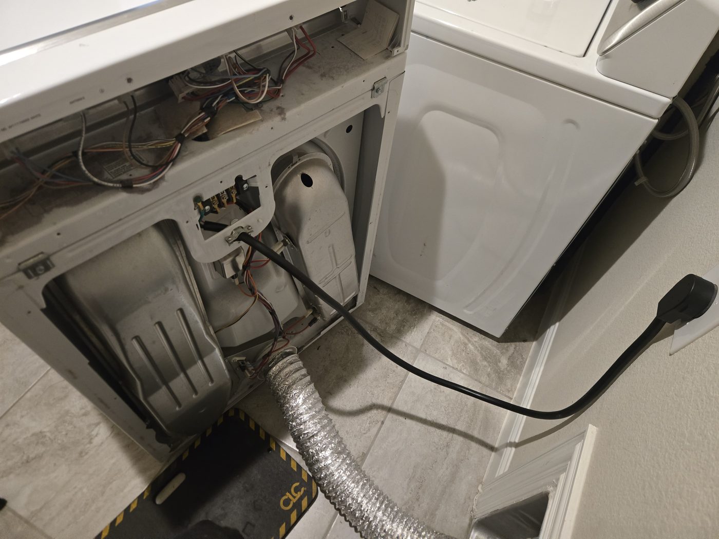 Rear of a dryer showing the vent duct connection